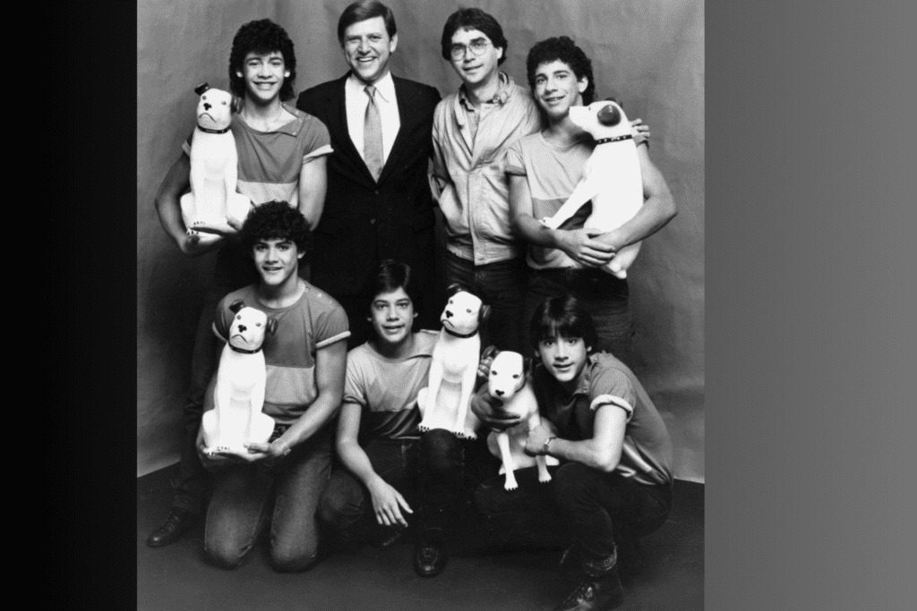 Jose Menendez, top row, second from left, is pictured with former members of Menudo in 1983, including Roy Rossello, bottom right. 
